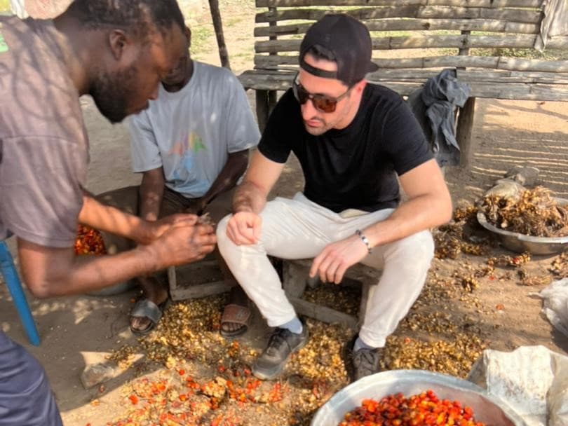 Processing palm fruit with the local community