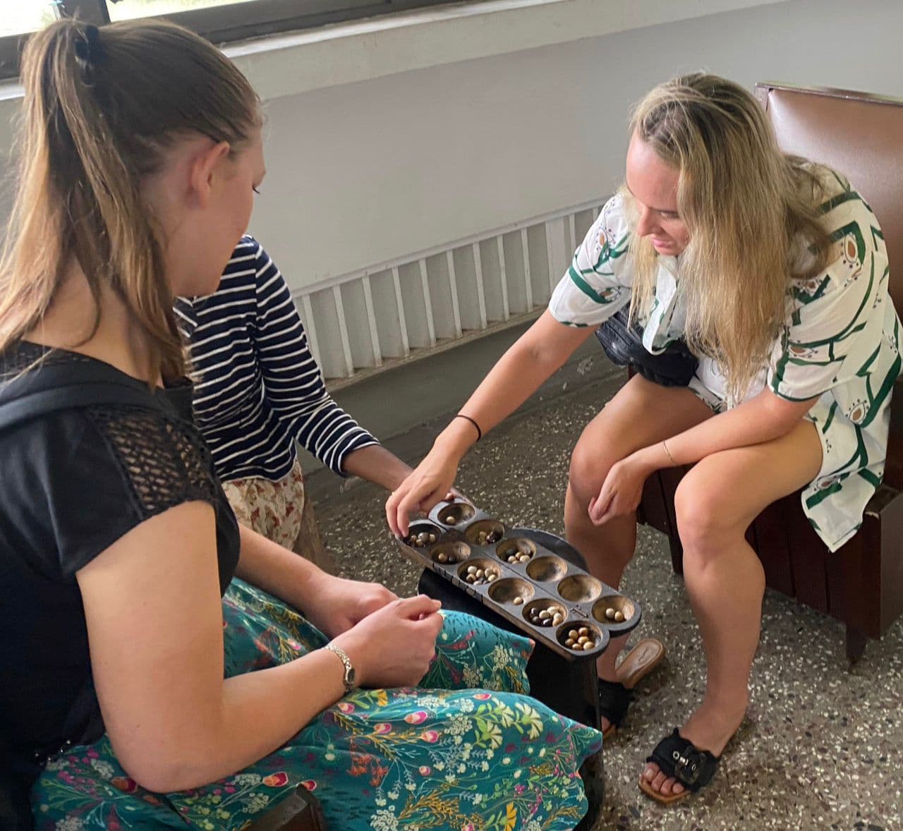 Tour group enjoying local craft workshop