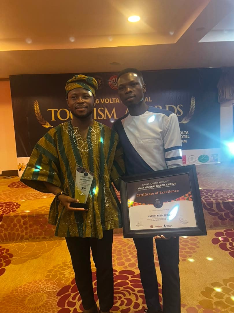 Vince receiving the Volta Regional Tour Guide of the Year 2026 award from the Ghana Tourism Authority